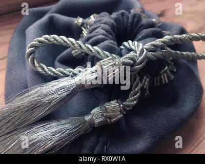 Prediction esoteric witch gray textile bag for tarot and runes Stock Photo