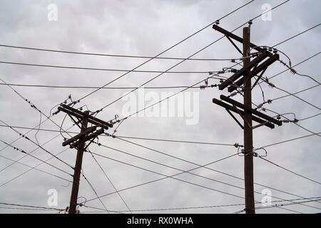 Electric poles servicing multiple lines in Alpine, west Texas. Stock Photo