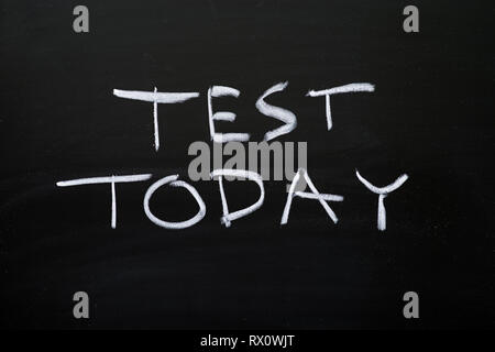 test today in white chalk on black chalkboard Stock Photo