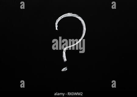 question mark ? written on a blackboard with white chalk Stock Photo