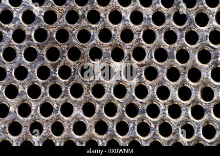 macro image of old metal kitchen strainer with holes Stock Photo