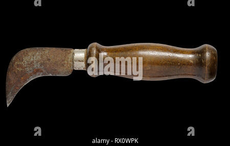 old linoleum hook knife isolated on black background Stock Photo