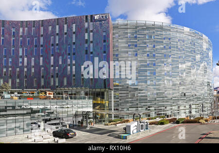 The new 'W' Aloft hotel next to the Excel Exhibition Centre in London's docklands district, east of the City. Shows multi-coloured metallic cladding. Stock Photo