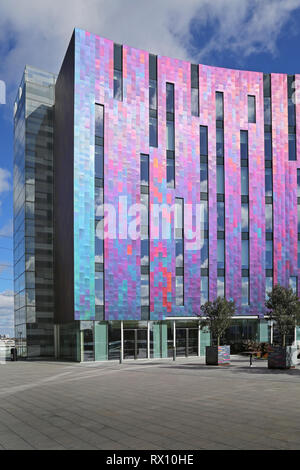 The new 'W' Aloft hotel next to the Excel Exhibition Centre in London's docklands district, east of the City. Shows multi-coloured metallic cladding. Stock Photo