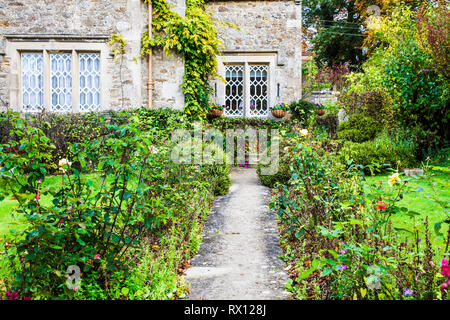 The front garden of a stone cottage in the Cotswolds, England. Stock Photo