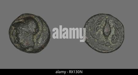 Coin Depicting the Goddess Athena. Greek. Date: 340 BC. Dimensions: Diam. 1.1 cm; 1.38 g. Bronze. Origin: Ancient Greece. Museum: The Chicago Art Institute. Stock Photo