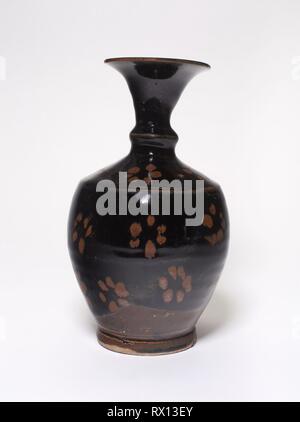 Vase with Stylized Petals. China. Date: 1100-1368. Dimensions: H. 19.6 cm (7 3/4 in.); diam. 11.3 cm (4 7/16 in.). Stoneware with black and brown glazes. Origin: China. Museum: The Chicago Art Institute. Stock Photo
