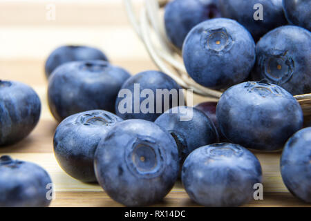 Macro shot of fresh ripe blueberries in wicker basket Stock Photo