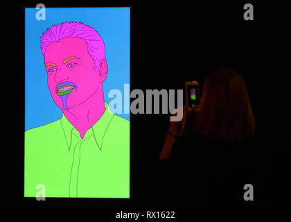 Embargoed to 2300 Friday March 8 A visitor photographs Commissioned Portrait Untitled (George) by Michael Craig-Martin, during a photo call for The George Michael Collection art sale at Christie's, London. Stock Photo