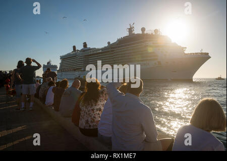 KEY WEST, FLORIDA, USA - JANUARY 13, 2019: Visitors watch the Carnival Equinox depart Mallory Square, recently damaged by a cruise ship accident. Stock Photo