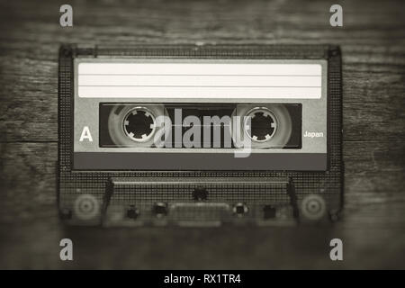 Retro stylized photo of vintage Audio cassette tape with blur and noise effect. Stock Photo