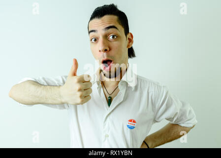 Young Latin man proud after voting in his first American elections Stock Photo