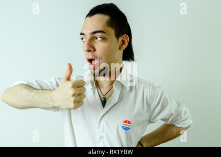 Young Latin man proud after voting in his first American elections Stock Photo