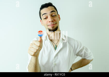 Young Latin man proud after voting in his first American elections Stock Photo