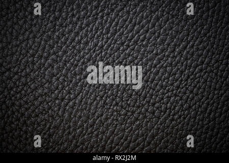 Black natural leather close-up background dark background texture black leather Stock Photo
