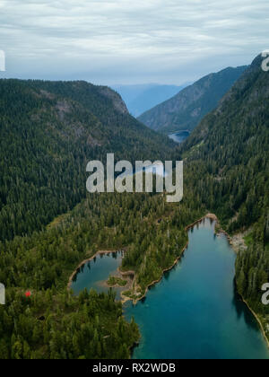 Aerial view of Brunswick Lake and Hanover Lake surrounded by the beautiful Canadian Mountains. Taken near Squamish, North of Vancouver, BC, Canada. Stock Photo