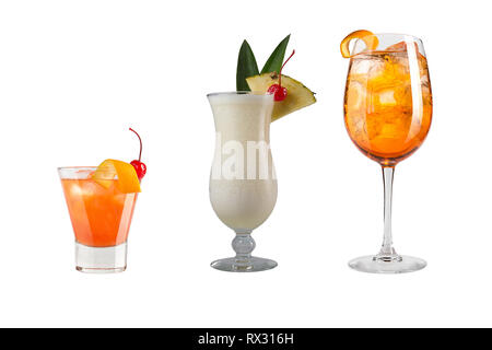 A variety of alcoholic drinks, beverages and cocktails on a white background. Three different drinks in glass goblets decorated with fruits and berrie Stock Photo