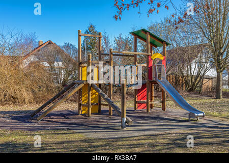 Jungle gym on a deserted playground in late autumn Stock Photo