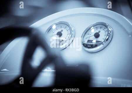 Close up shot of some gauges on a boat. Stock Photo