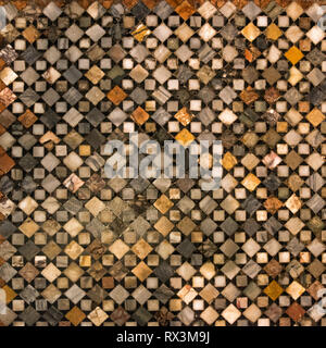 Old mosaic floor made of stone of different colors. Stock Photo