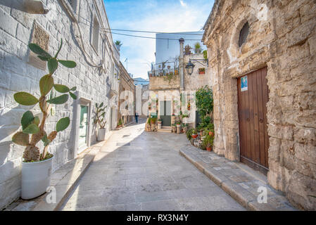 Monopoli, Puglia, Italy - Street and alley with a view of colorful houses in the old town. A region of Apulia