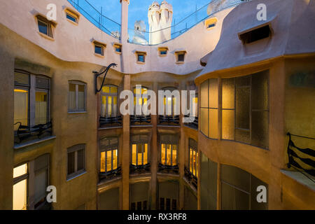At the top of one of the atriums at Casa Mila, night coming in Barcelona, Spain Stock Photo