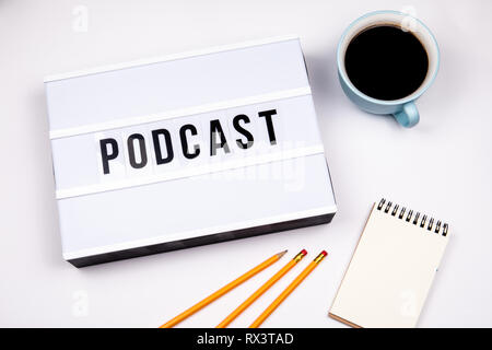 Podcast, Text in lightbox. White desk with stationery Stock Photo
