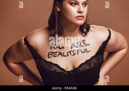 sexy fat woman with big breasts in bra with black wings Stock Photo - Alamy
