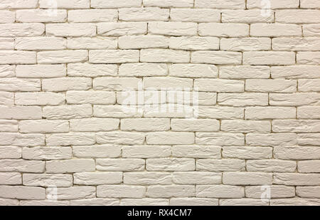 Close-up of white painted whitewashed solid brick wall. Abstract copy space background, Bricklaying, construction and masonry concept. Stock Photo