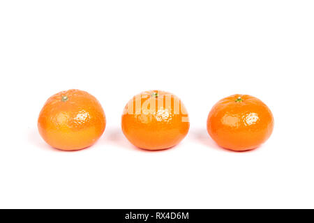 Three small oranges isolated on white background Stock Photo