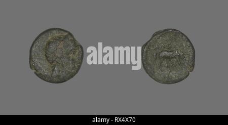 Coin Depicting the God Apollo. Greek. Date: 300 BC. Dimensions: Diam. 1.5 cm; 3.68 g. Bronze. Origin: Ancient Greece. Museum: The Chicago Art Institute. Stock Photo