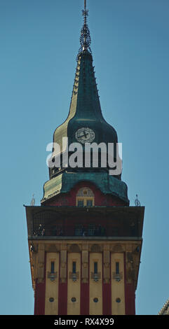 Top of the tower with a clock on a catholic church Stock Photo
