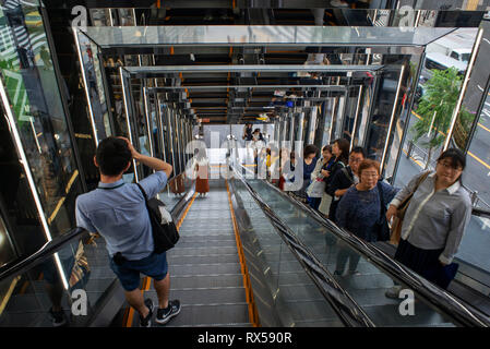 Escalator entrance to the illuminated Tokyu Plaza Ginza shopping building, Tokyo, Japan Stock Photo