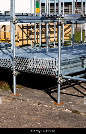 construction site scaffold storage area constructed using scaffolding poles Stock Photo
