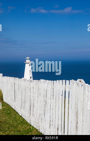 Fence and lighthouse, Cape Spear Lighthouse National Historic Site, Newfoundland, Canada Stock Photo