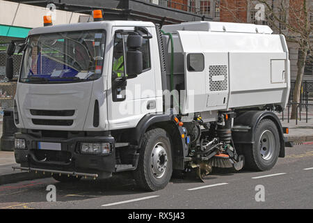 Mechanical Street Sweeper and Vacuum Cleaning Truck Stock Photo