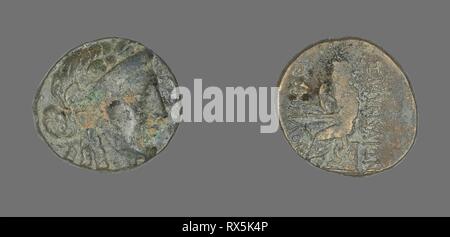 Coin Depicting the God Apollo. Greek. Date: 200 BC-1 BC. Dimensions: Diam. 2 cm; 6.69 g. Bronze. Origin: Ancient Greece. Museum: The Chicago Art Institute. Stock Photo