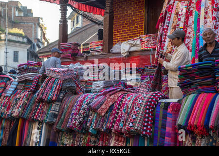 Scarf seller on a market in Kathmandu, Nepal Stock Photo