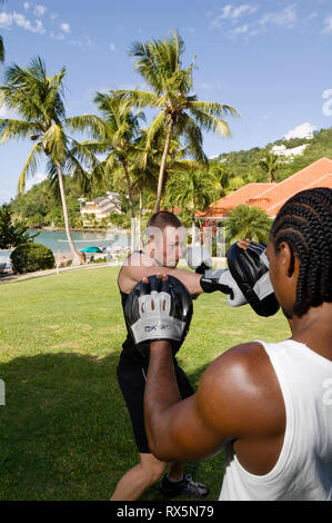 Man practicing boxing in park Stock Photo
