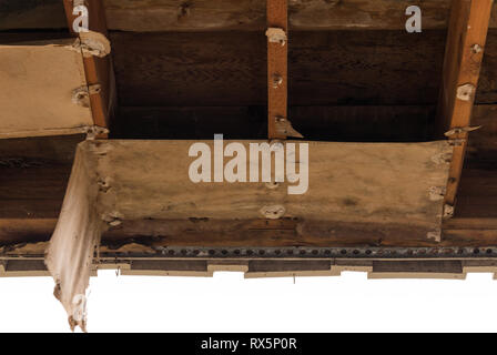 Water damaged roof after ceiling has fallen away in need of repair Stock Photo