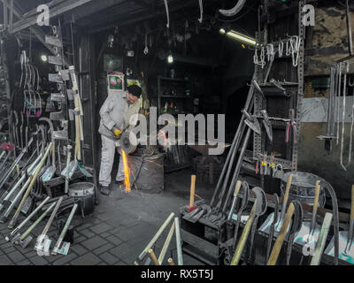 Kayhan Bazaar, Bursa / Turkey - October 27 2018: Man working in blacksmith workshop Stock Photo