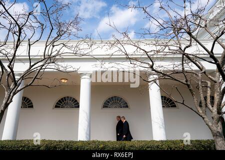 U.S President Donald Trump escorts Czech Prime Minister Andrej Babis to the Oval Office along the Colonnade of the White House March 7, 2019 in Washington, DC. Stock Photo