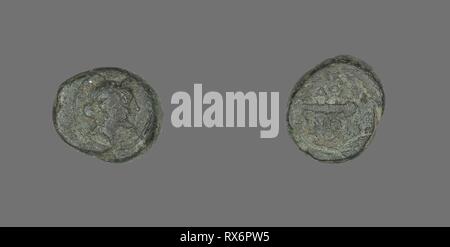 Coin Depicting the God Apollo. Greek. Date: 133 BC. Dimensions: Diam. 1.5 cm; 3.93 g. Bronze. Origin: Ancient Greece. Museum: The Chicago Art Institute. Stock Photo