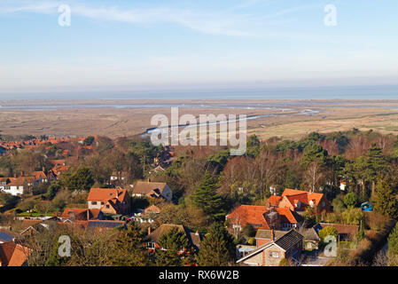 A view over Blakeney village to the salt marshes and Blakeney Point from the Church tower at Blakeney, Norfolk, England, United Kingdom, Europe. Stock Photo