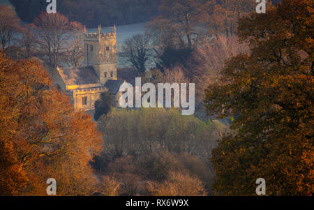 St. Eadburgha's Church in Autumn. Cotswold landscape scene at sunrise Stock Photo