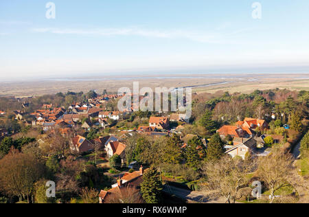 A view over Blakeney village towards the salt marshes and Blakeney Point from the Church tower at Blakeney, Norfolk, England, United Kingdom, Europe. Stock Photo