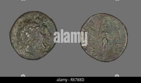 Coin Depicting the God Zeus. Greek. Date: 133 BC-48 BC. Dimensions: Diam. 2.2 cm; 7.56 g. Bronze. Origin: Ancient Greece. Museum: The Chicago Art Institute. Stock Photo