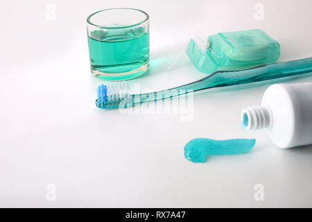 Equipment for oral hygiene on a white table. Horizontal composition. Elevated view. Stock Photo