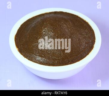 Shrimp paste in white bowl on white background. Stock Photo