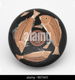 Fish Plate. Greek; Tarentum, Apulia, Italy; Attributed to the Perrone-Phrixos Group. Date: 340 BC-320 BC. Dimensions: 4.2 × 20.4 × 20.4 cm (1 5/8 × 8 1/16 × 8 1/16 in.). Terra-cotta, decorated in the red-figure technique. Origin: Tarentum. Museum: The Chicago Art Institute. Author: ANCIENT GREEK. Stock Photo